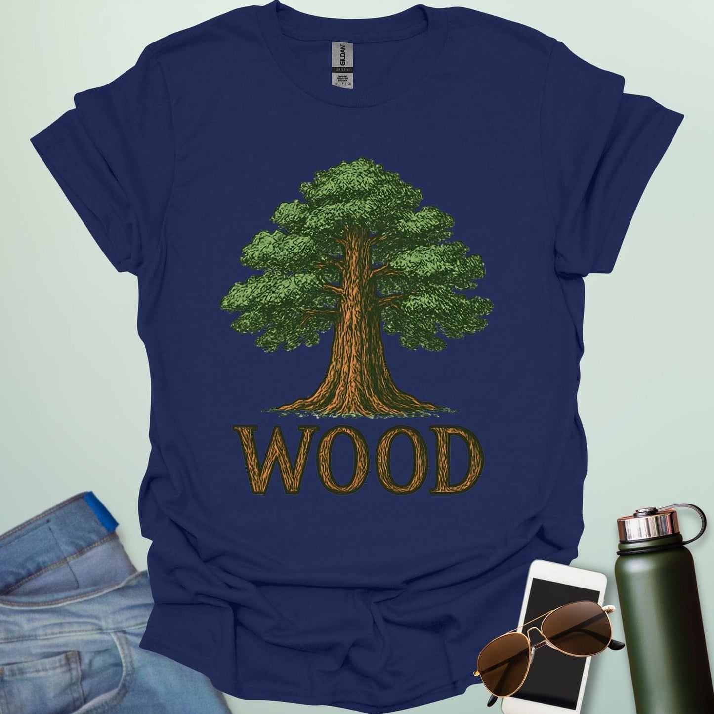 Wood tee with stylized tree / nature motif — perfect for fans of forests, national parks & Taylor Swift.