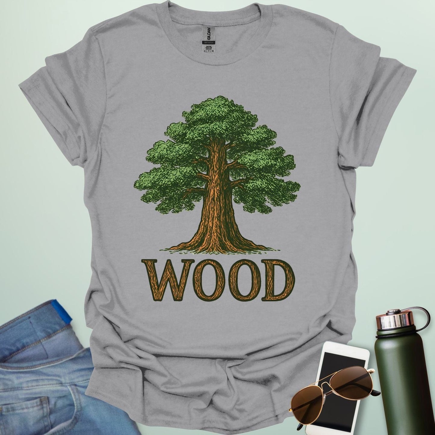 Wood tee with stylized tree / nature motif — perfect for fans of forests, national parks & Taylor Swift.
