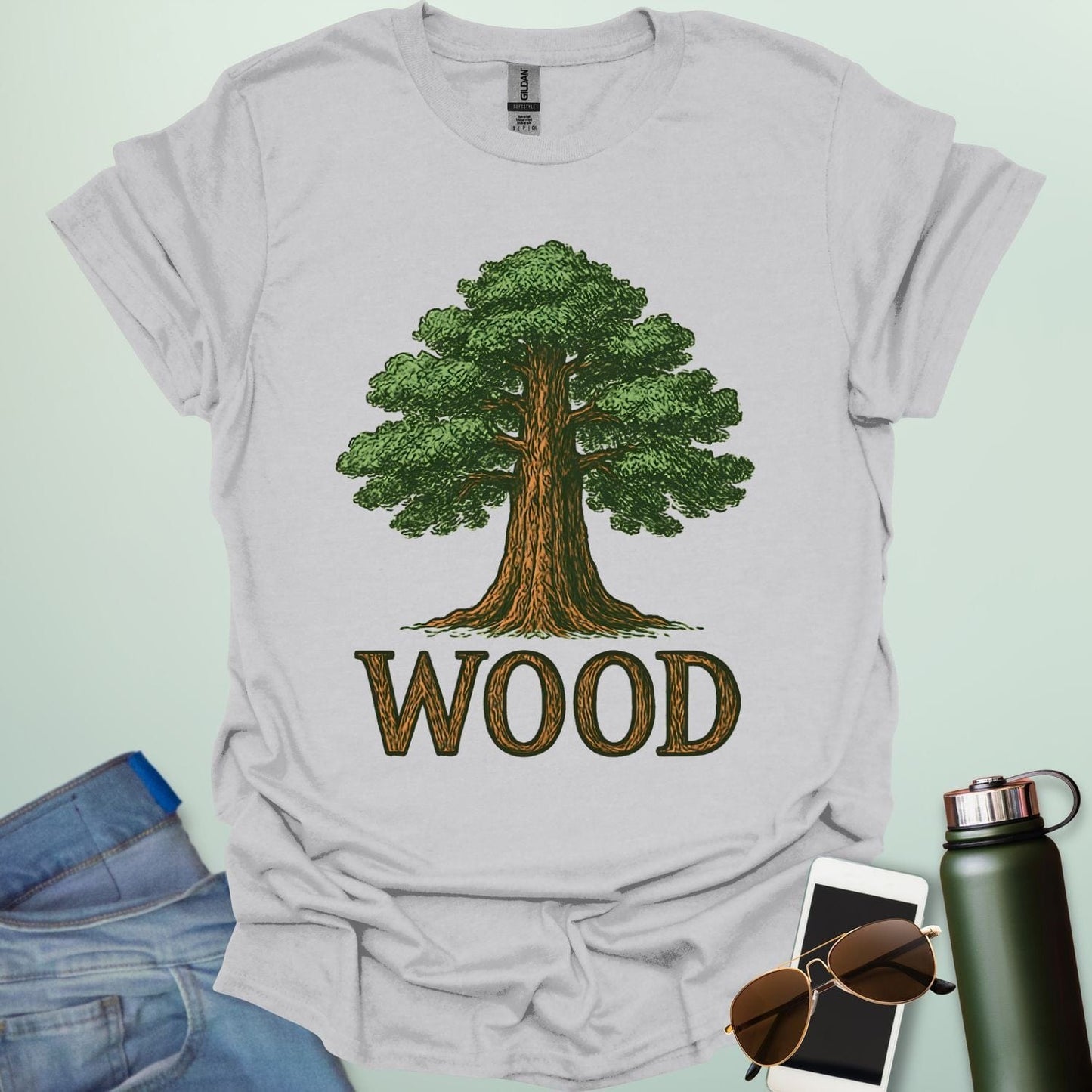 Wood tee with stylized tree / nature motif — perfect for fans of forests, national parks & Taylor Swift.