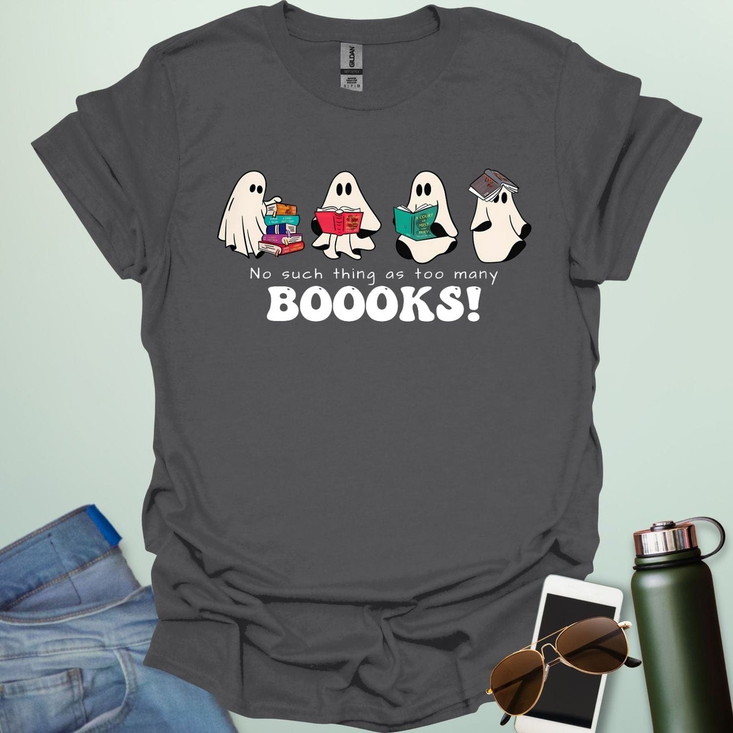 No Such Thing As Too Many Booooks t-shirt with ghostly lettering and book graphic β a spooky bookworm design for readers and teachers.
