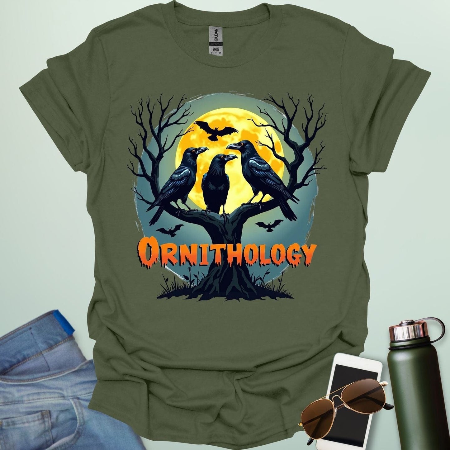 Ornithology Raven Halloween t-shirt featuring a raven perched with spooky Halloween elements — science & bird lover design.