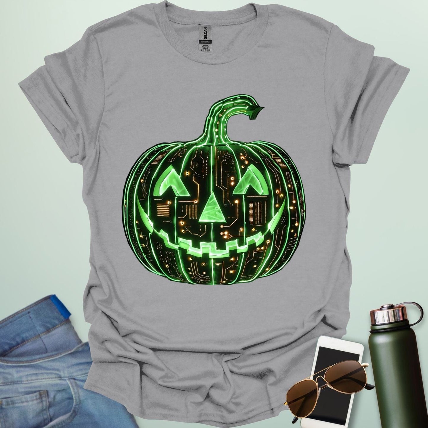 Pumpkin Tech t-shirt with glowing green jack-o-lantern circuit board design — Halloween STEM geek apparel.