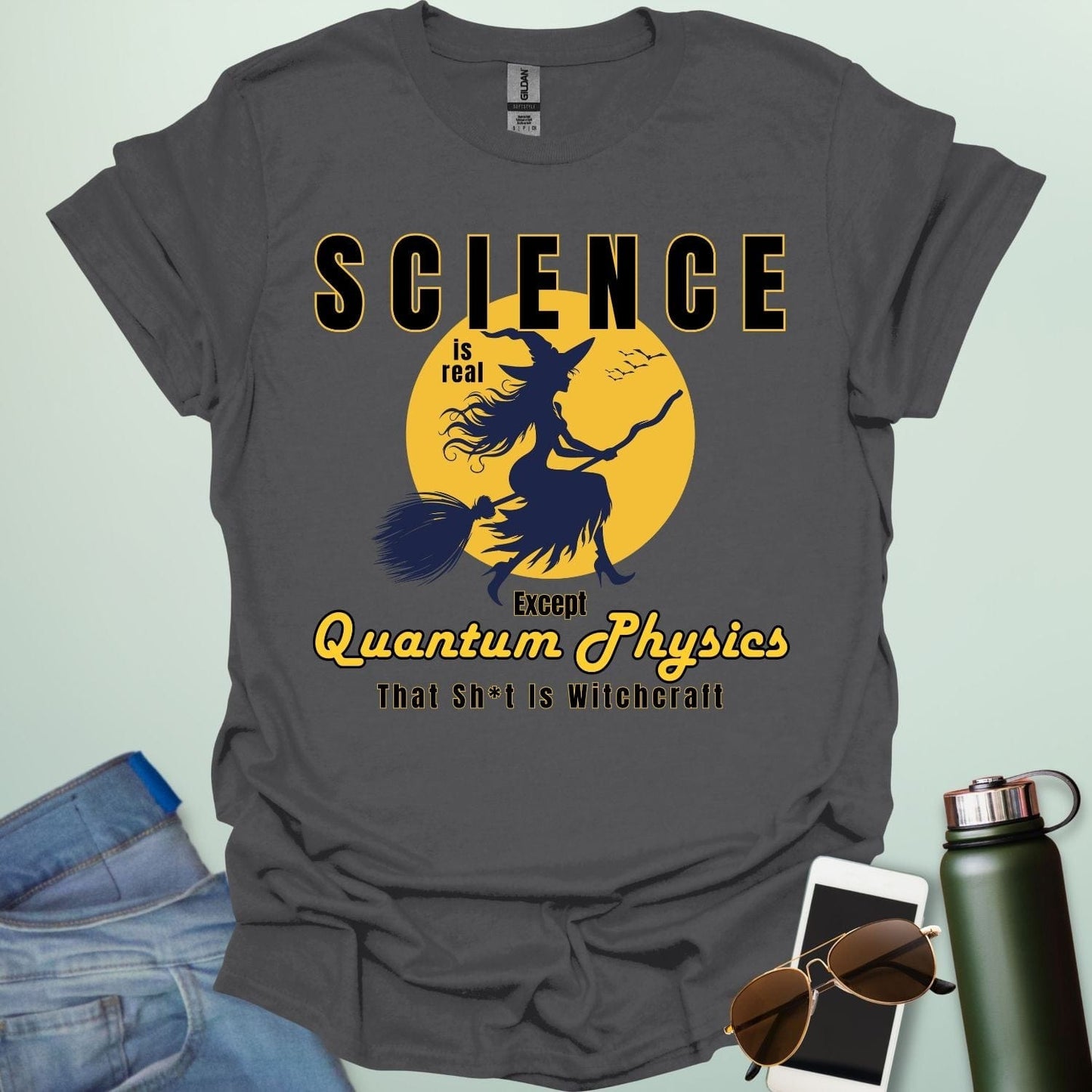 Quantum Physics Is Witchcraft t-shirt with bold typography — combining quantum physics and witchcraft themes for science & supernatural fans.