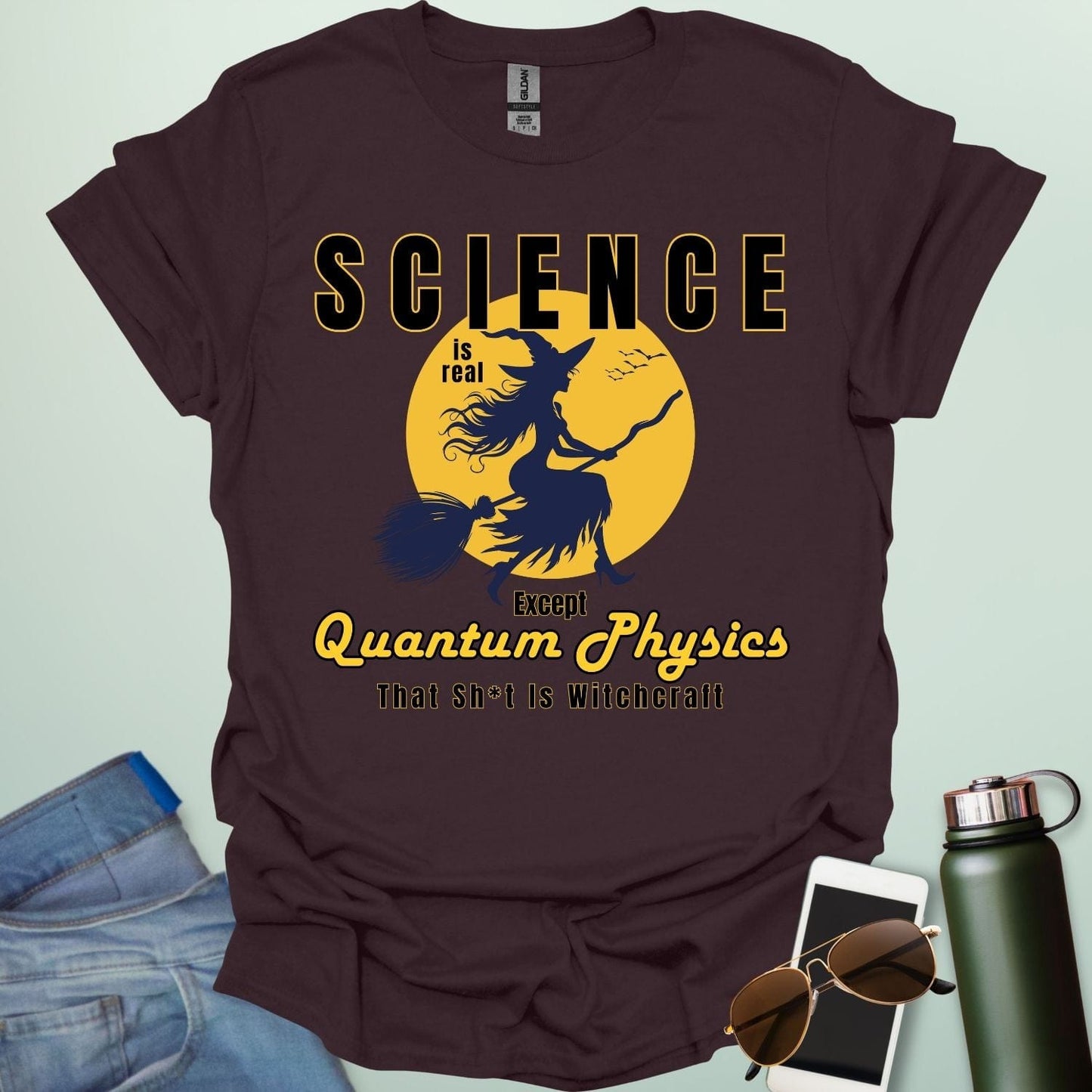 Quantum Physics Is Witchcraft t-shirt with bold typography — combining quantum physics and witchcraft themes for science & supernatural fans.