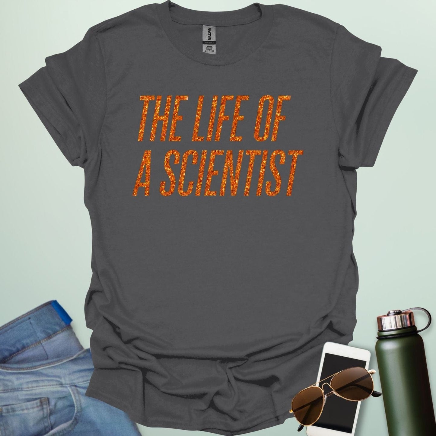 A charcoal grey t-shirt with the bold, distressed text 'THE LIFE OF A SCIENTIST.'