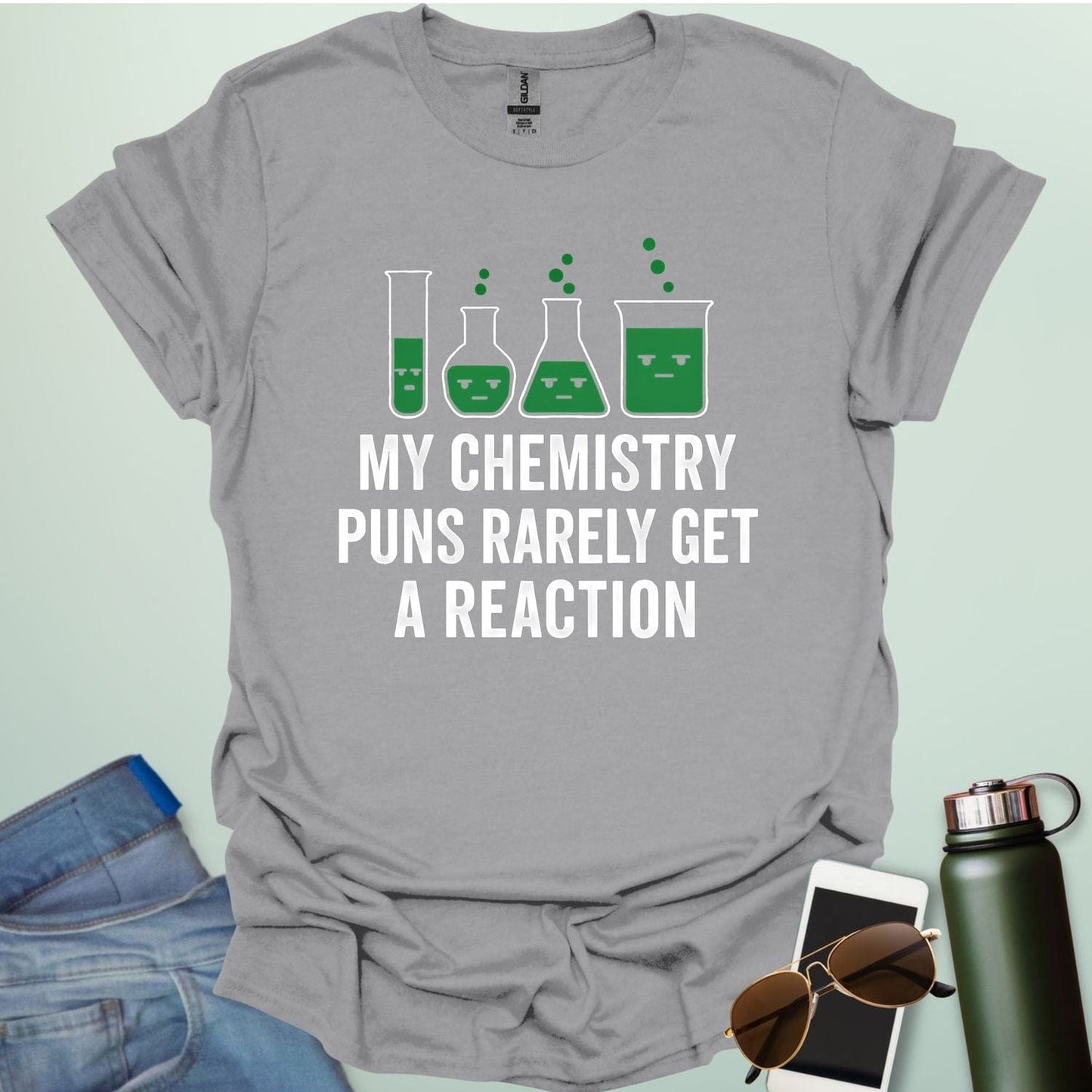 "My Chemistry Puns Rarely Get a Reaction' t-shirt with a humorous science pun design.