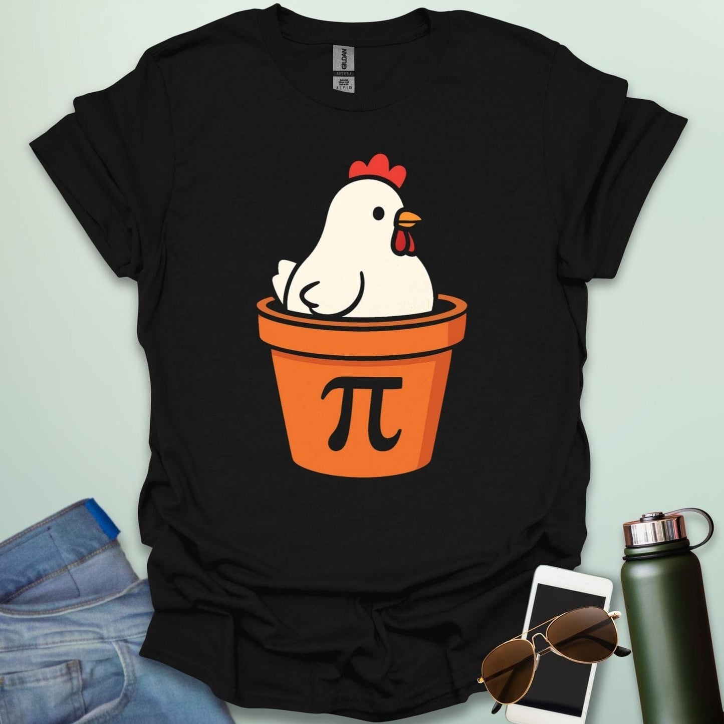A funny 'Chicken Pot Pi' t-shirt featuring a cartoon chicken in a pot with the Pi symbol.