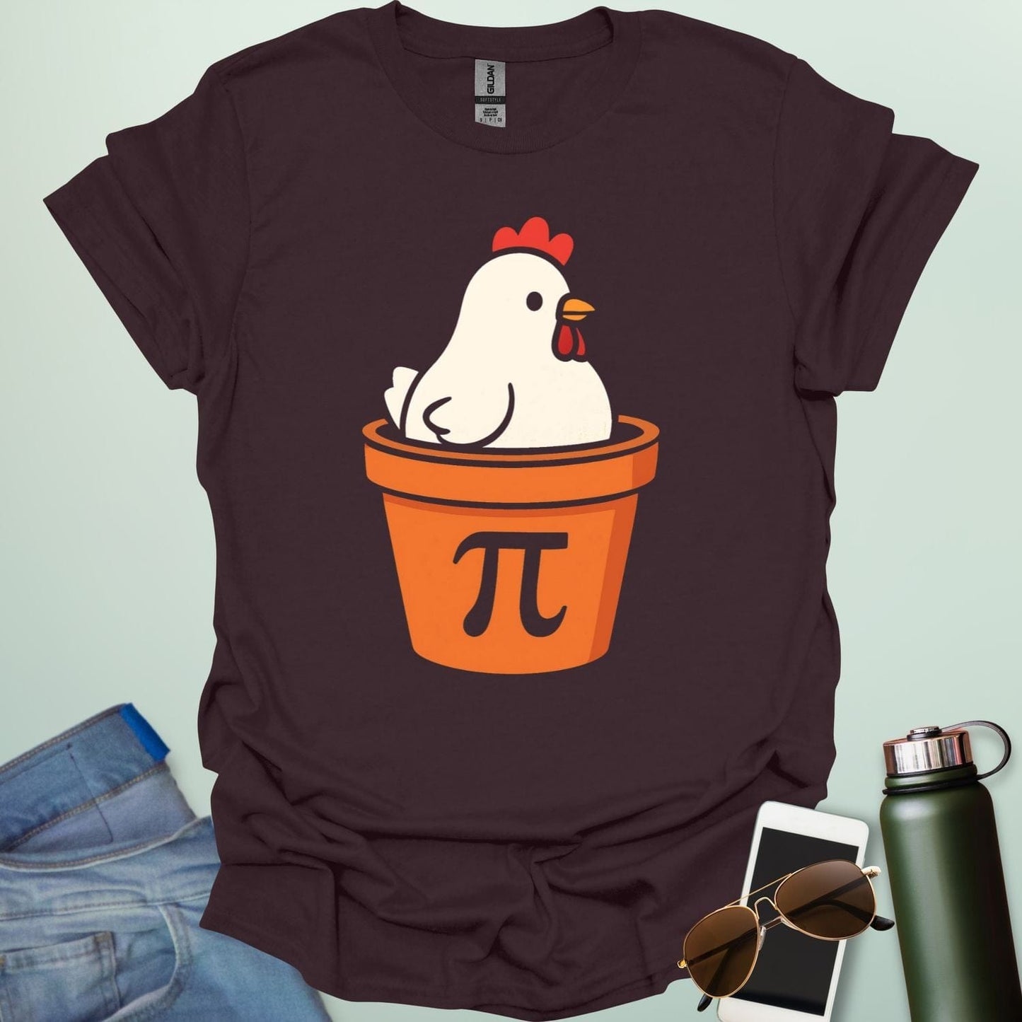 A funny 'Chicken Pot Pi' t-shirt featuring a cartoon chicken in a pot with the Pi symbol.