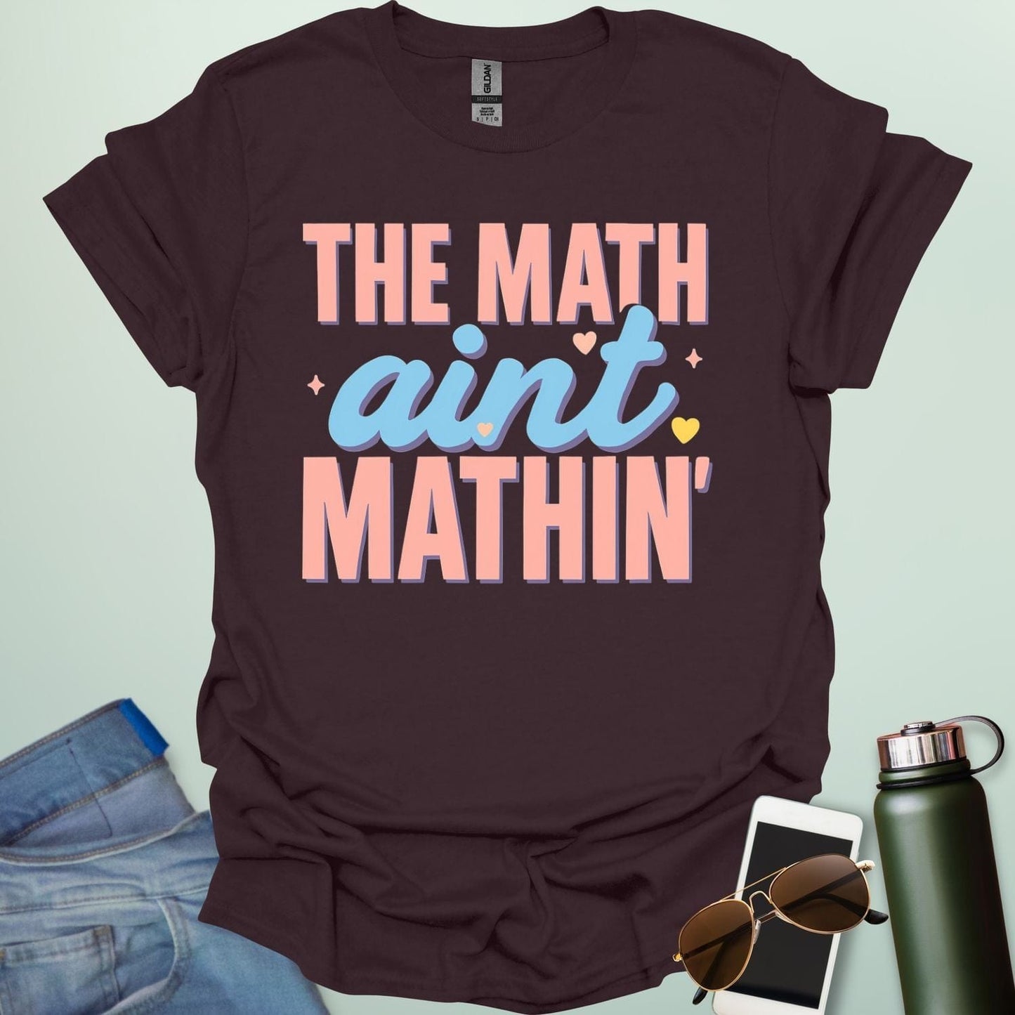 The Math Ain't Mathin'' t-shirt with stylized pink and blue lettering on a solid background.