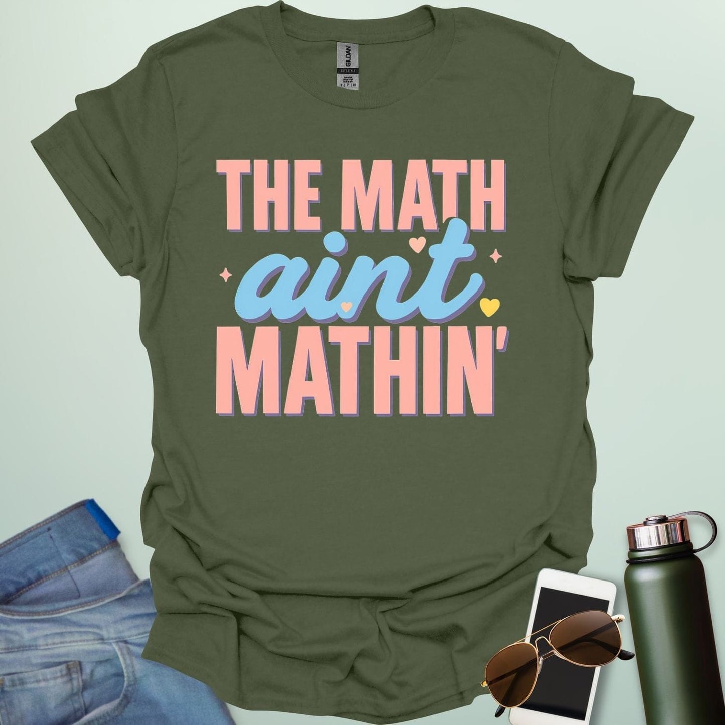The Math Ain't Mathin'' t-shirt with stylized pink and blue lettering on a solid background.