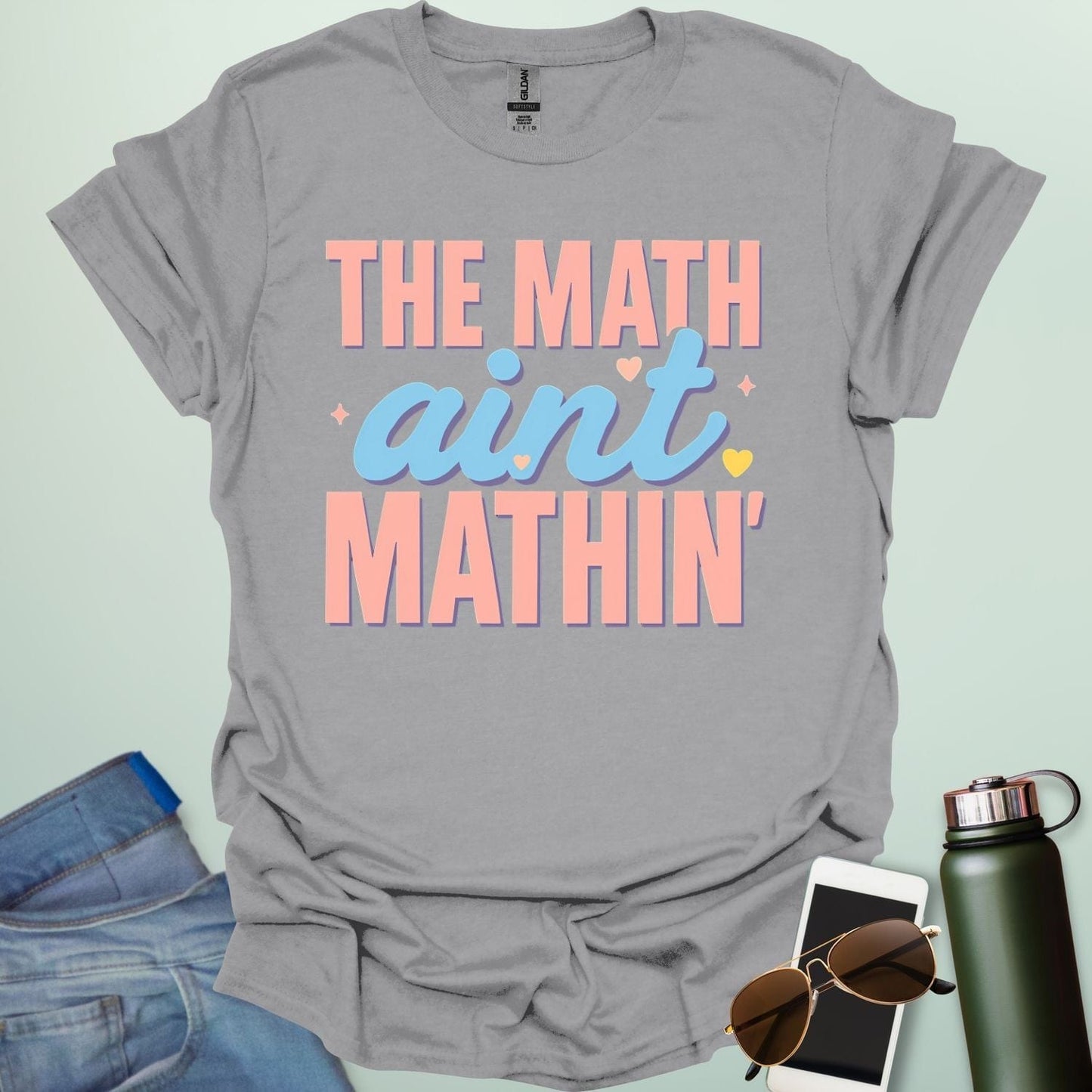The Math Ain't Mathin'' t-shirt with stylized pink and blue lettering on a solid background.
