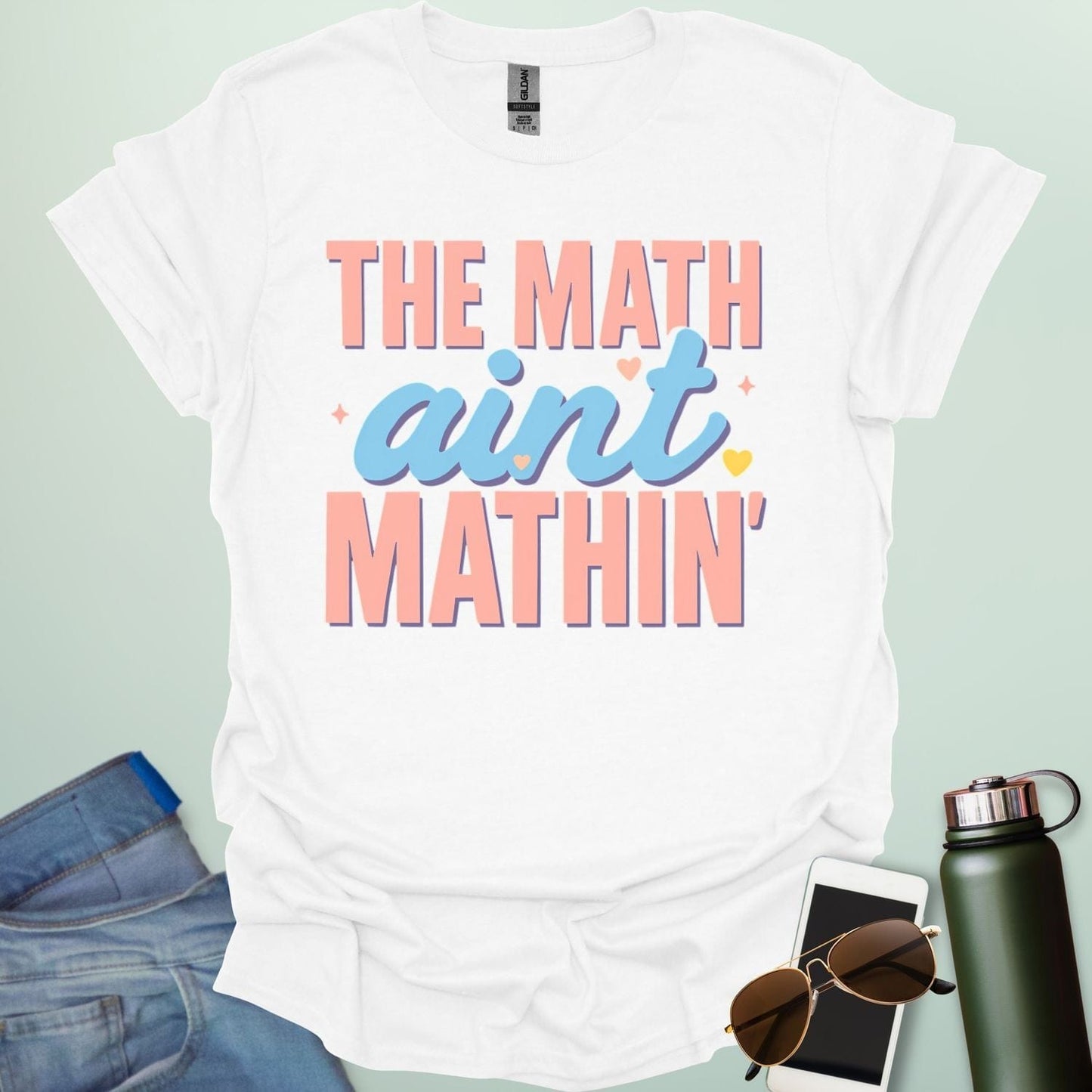The Math Ain't Mathin'' t-shirt with stylized pink and blue lettering on a solid background.