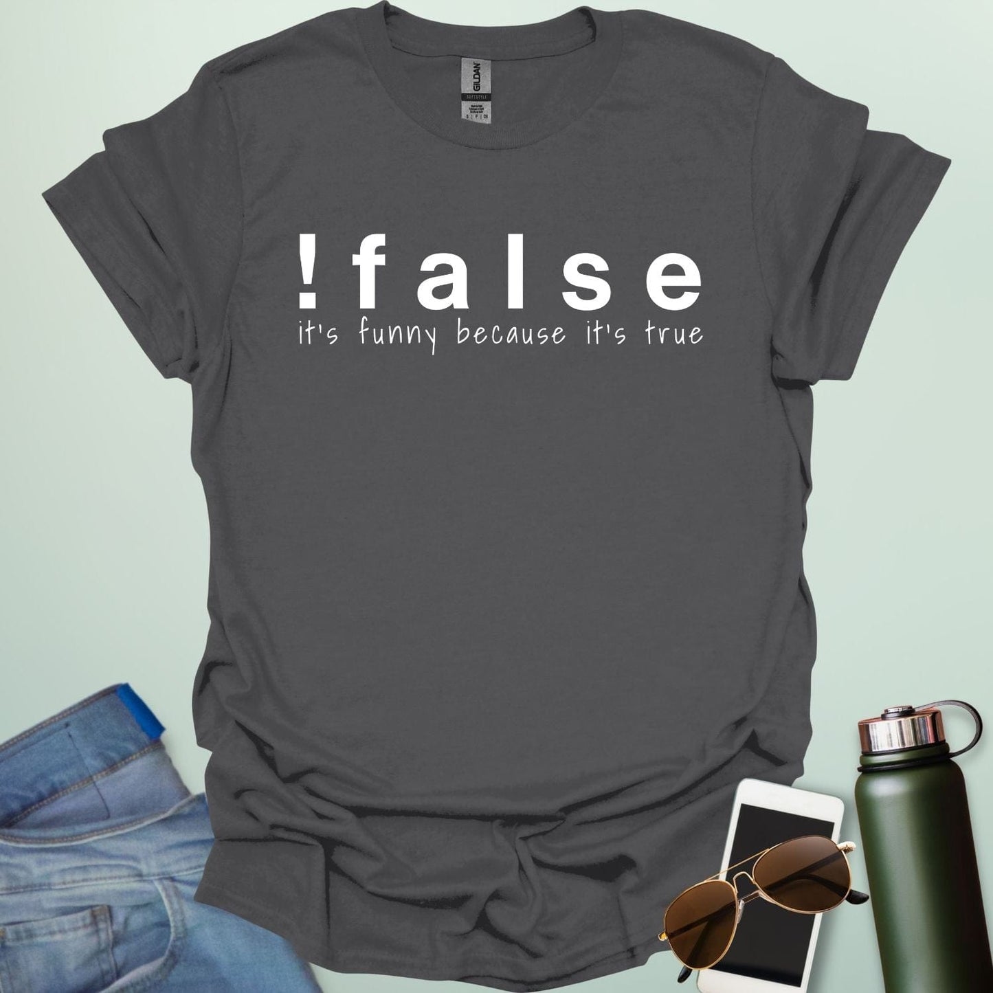 A charcoal grey shirt with the text '!false' in bold letters, with the tagline 'it's funny because it's true' in smaller letters below.