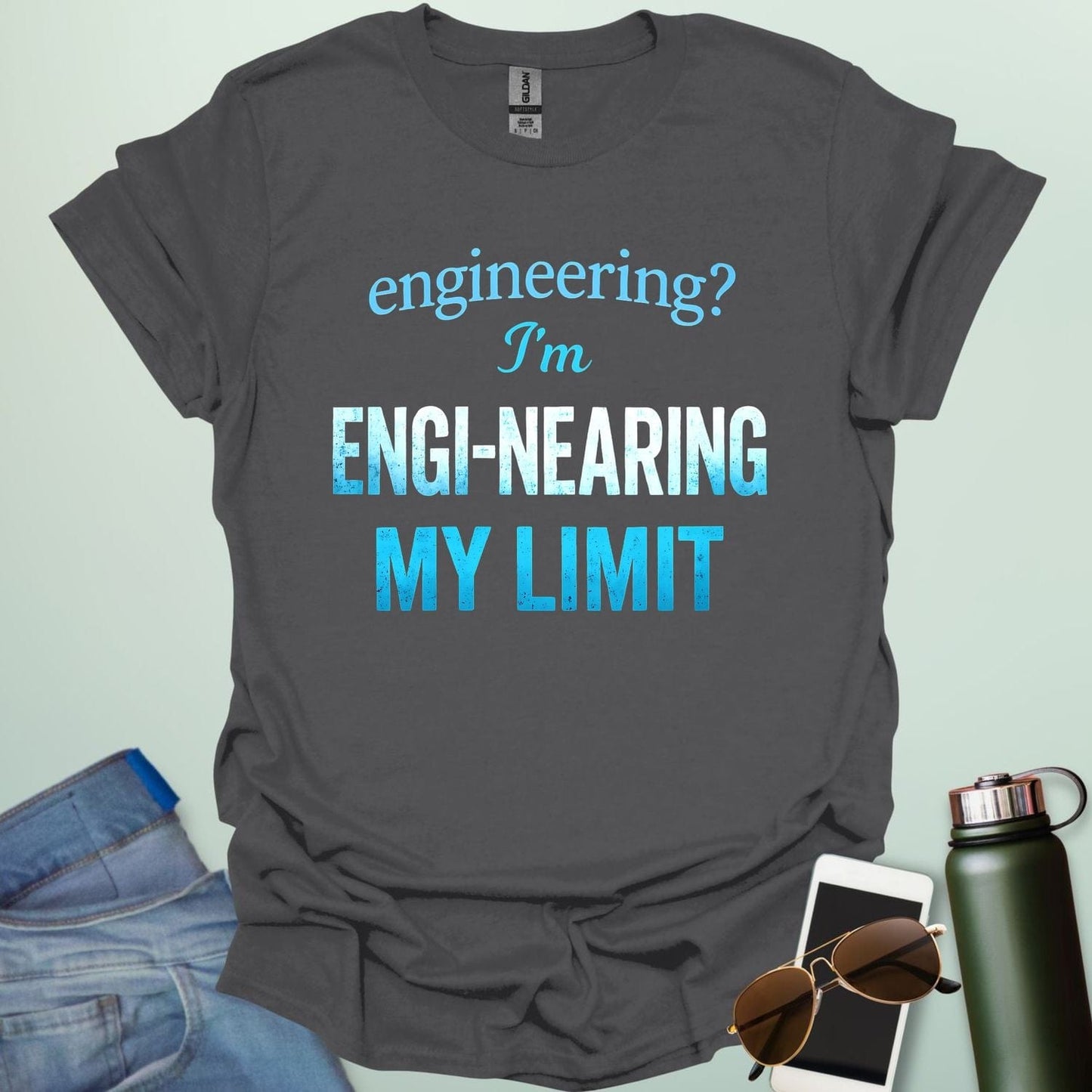 'Engineering? I'm Engi-nearing My Limit' t-shirt with a funny, distressed typography design.
