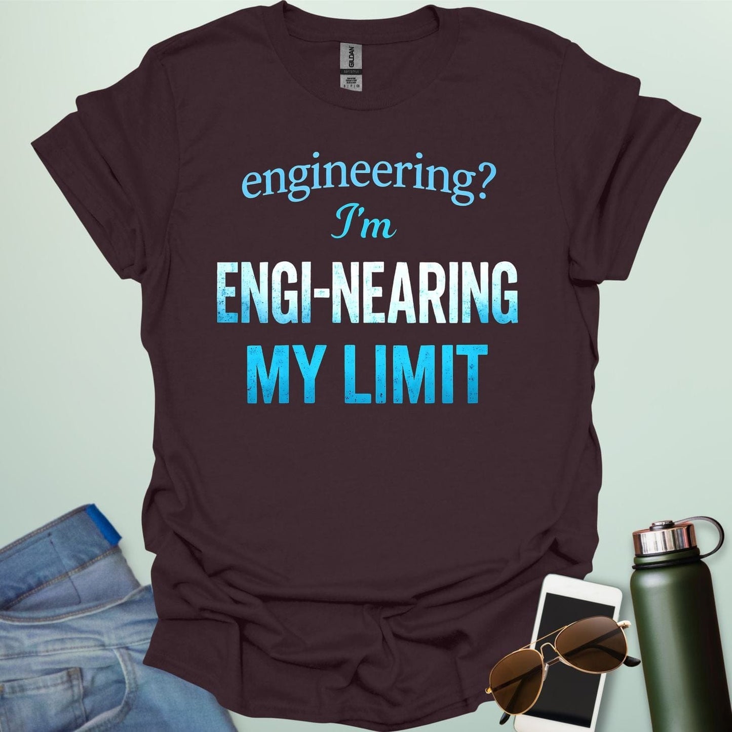 'Engineering? I'm Engi-nearing My Limit' t-shirt with a funny, distressed typography design.