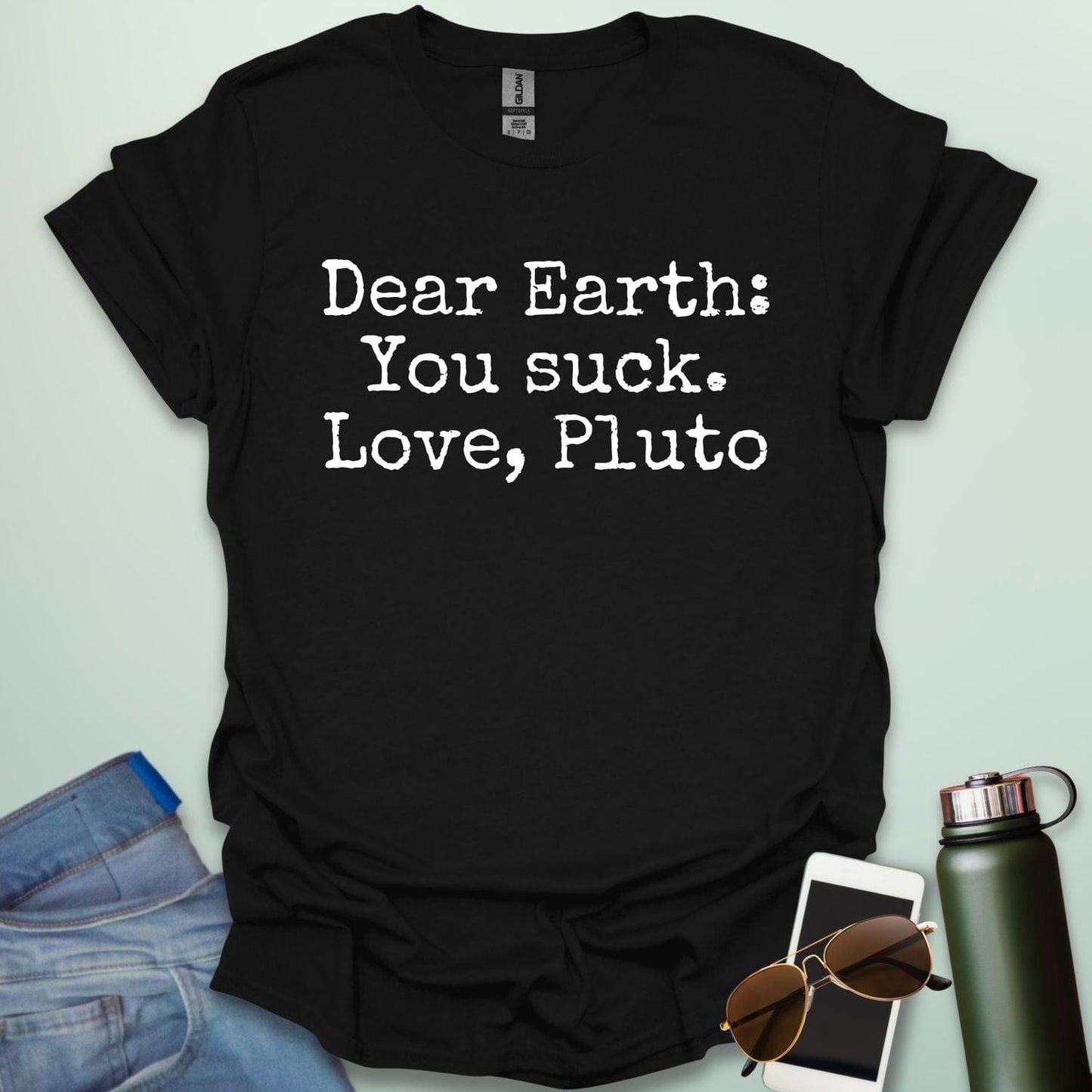 Black t-shirt with humorous text 'Dear Earth: You suck. Love, Pluto'.