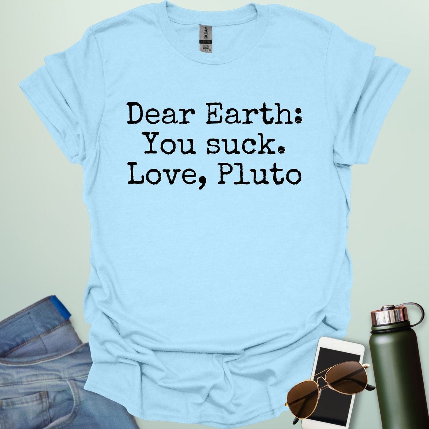 Light Blue t-shirt with humorous text 'Dear Earth: You suck. Love, Pluto'.