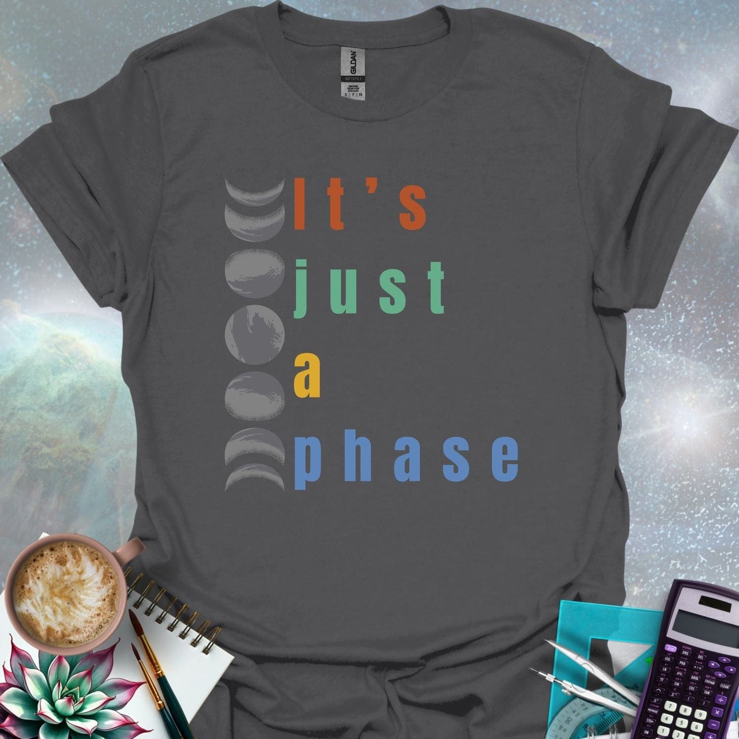 Vertical graphic of the eight moon phases with the text 'It's Just A Phase' in colorful stacked letters.