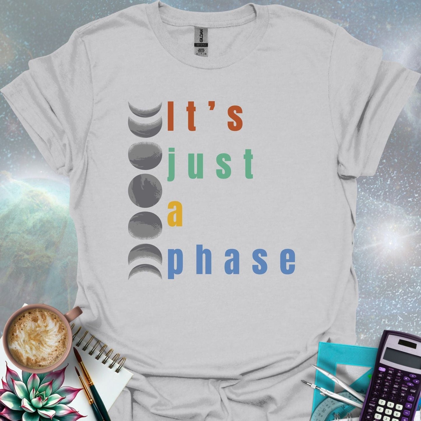 Vertical graphic of the eight moon phases with the text 'It's Just A Phase' in colorful stacked letters.