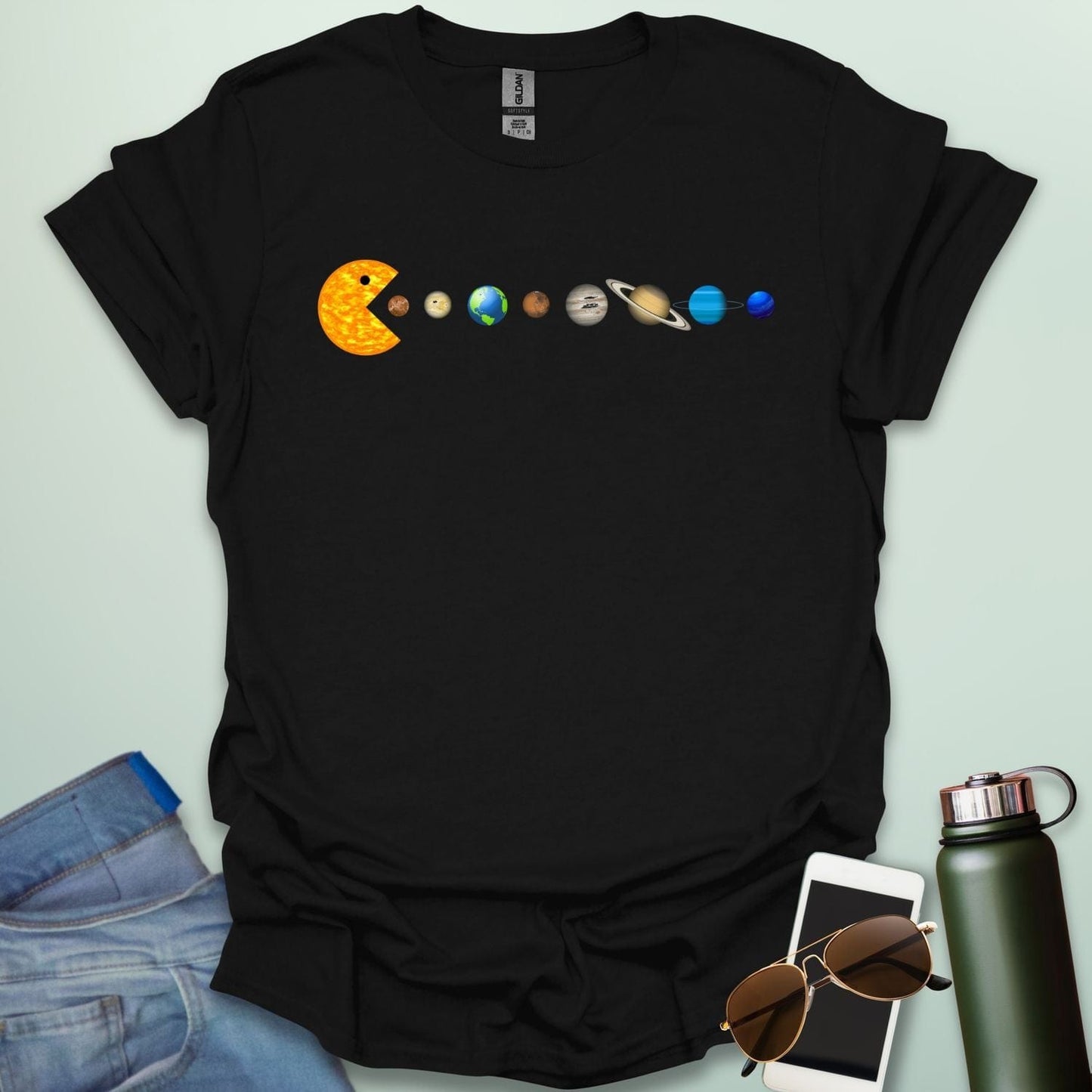 A Pac-Man-like character eating the planets of the solar system, with the sun as its mouth.