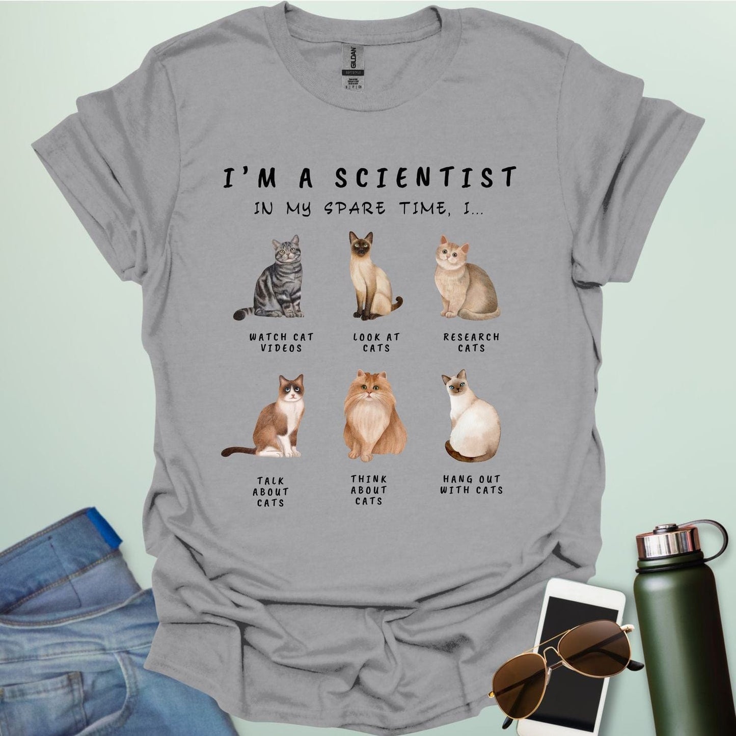 Sport Gray t-shirt with cat-themed text and graphics on a light green background