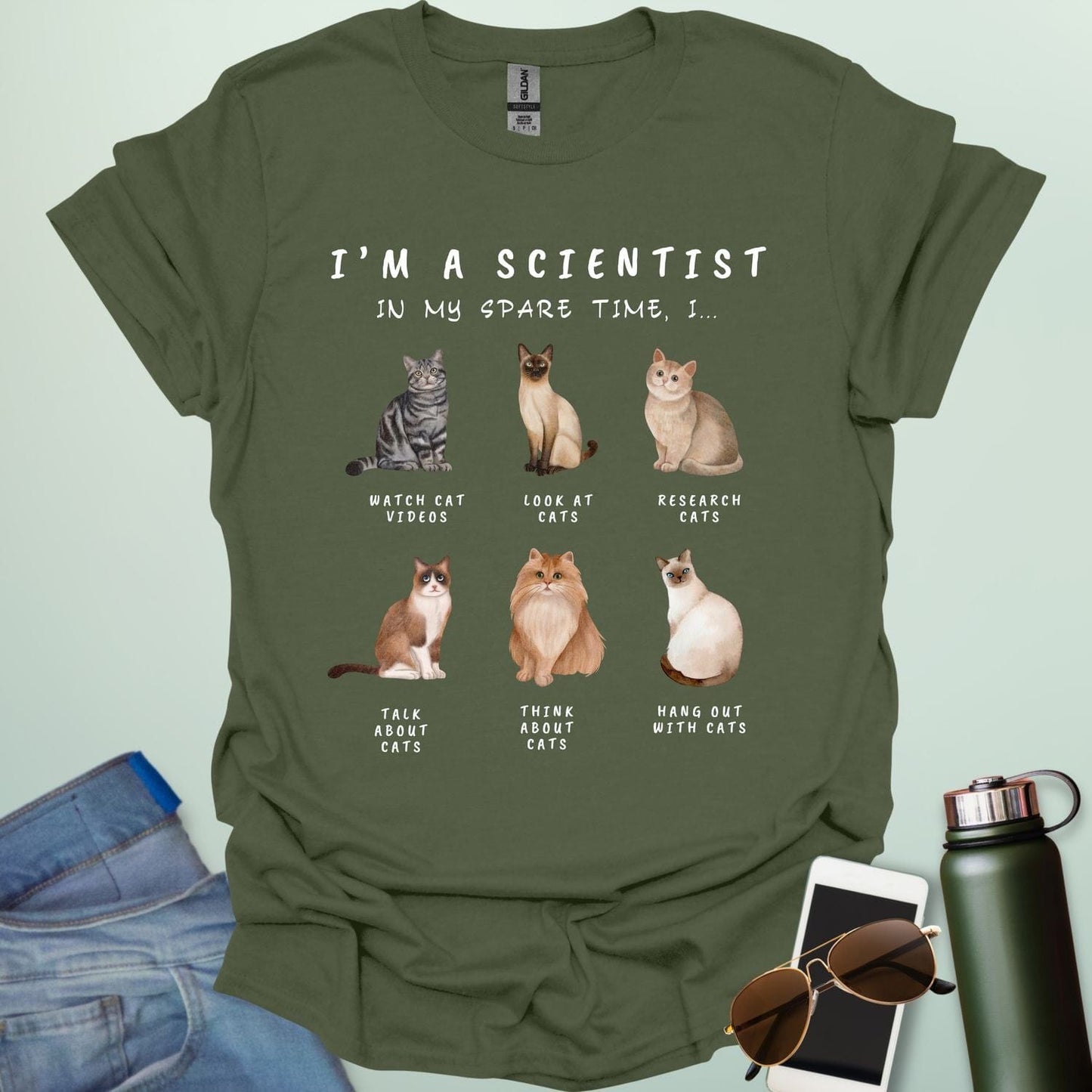 Military Green t-shirt with cat-themed text and illustrations on a light green background