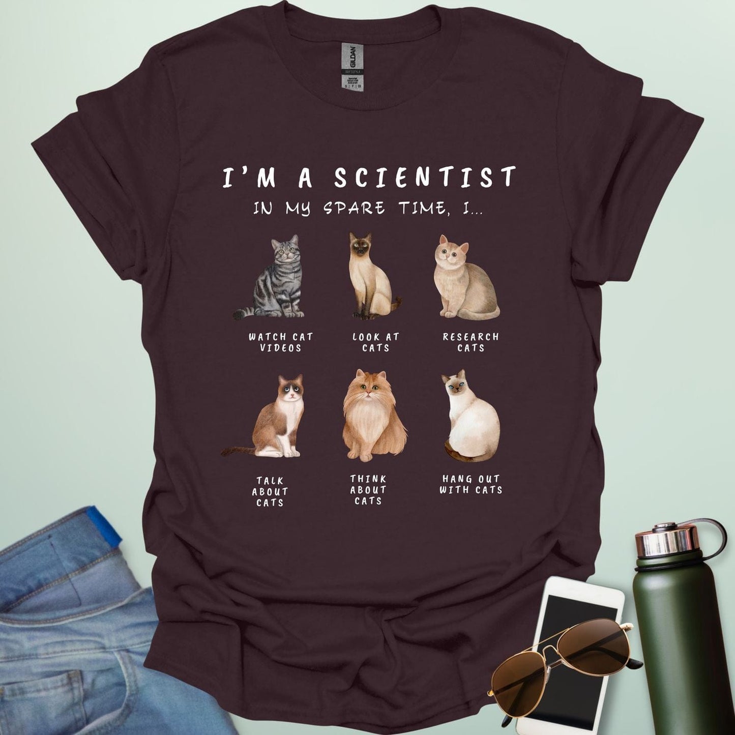 Dark Chocolate t-shirt with cat-themed text and graphics on a light green background
