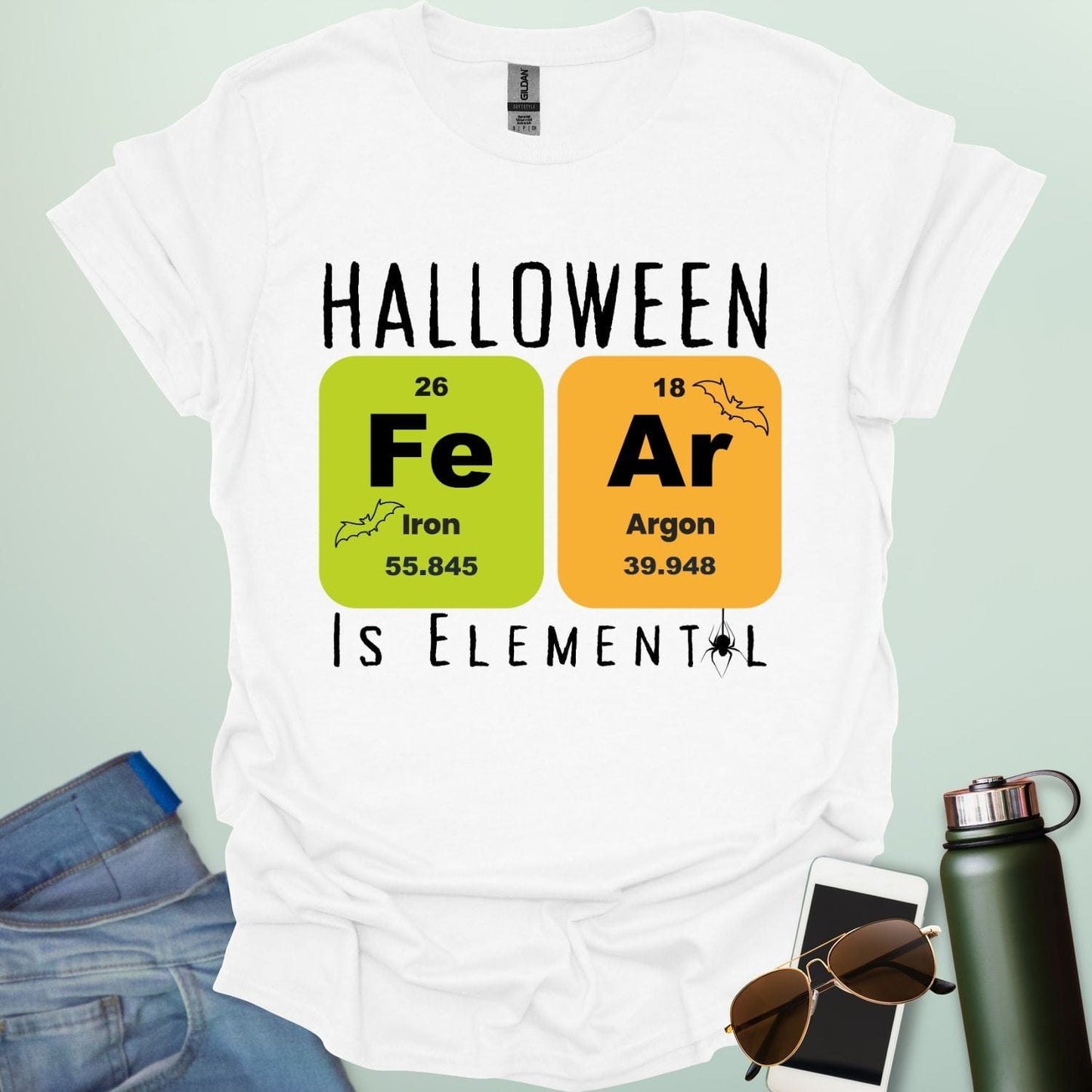 Fear Is Elemental t-shirt with periodic-table / chemistry element graphics — a Halloween science pun design for STEM fans.
