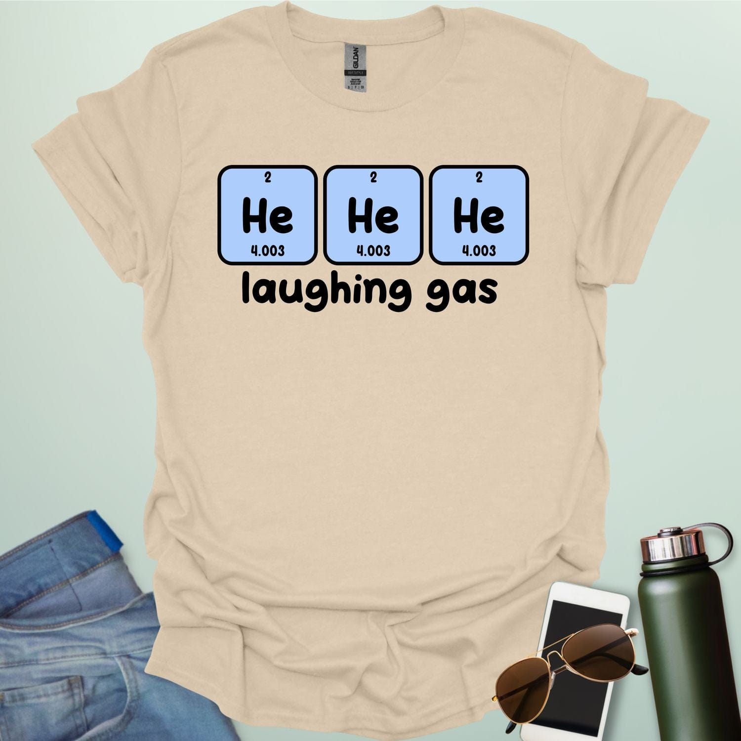 Three periodic table element boxes showing 'He' for Helium, with the text 'laughing gas' below.