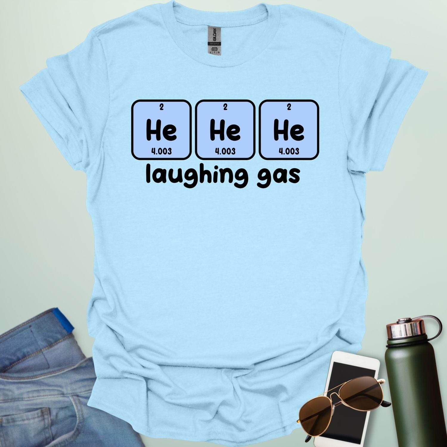 Three periodic table element boxes showing 'He' for Helium, with the text 'laughing gas' below.