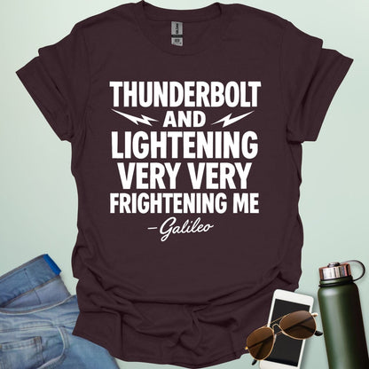 A dark chocolate t-shirt with the phrase 'THUNDERBOLT AND LIGHTENING VERY VERY FRIGHTENING ME' with lightning bolts, and '- Galileo' in script below.