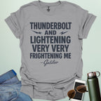 A sport grey t-shirt with the phrase 'THUNDERBOLT AND LIGHTENING VERY VERY FRIGHTENING ME' with lightning bolts, and '- Galileo' in script below.