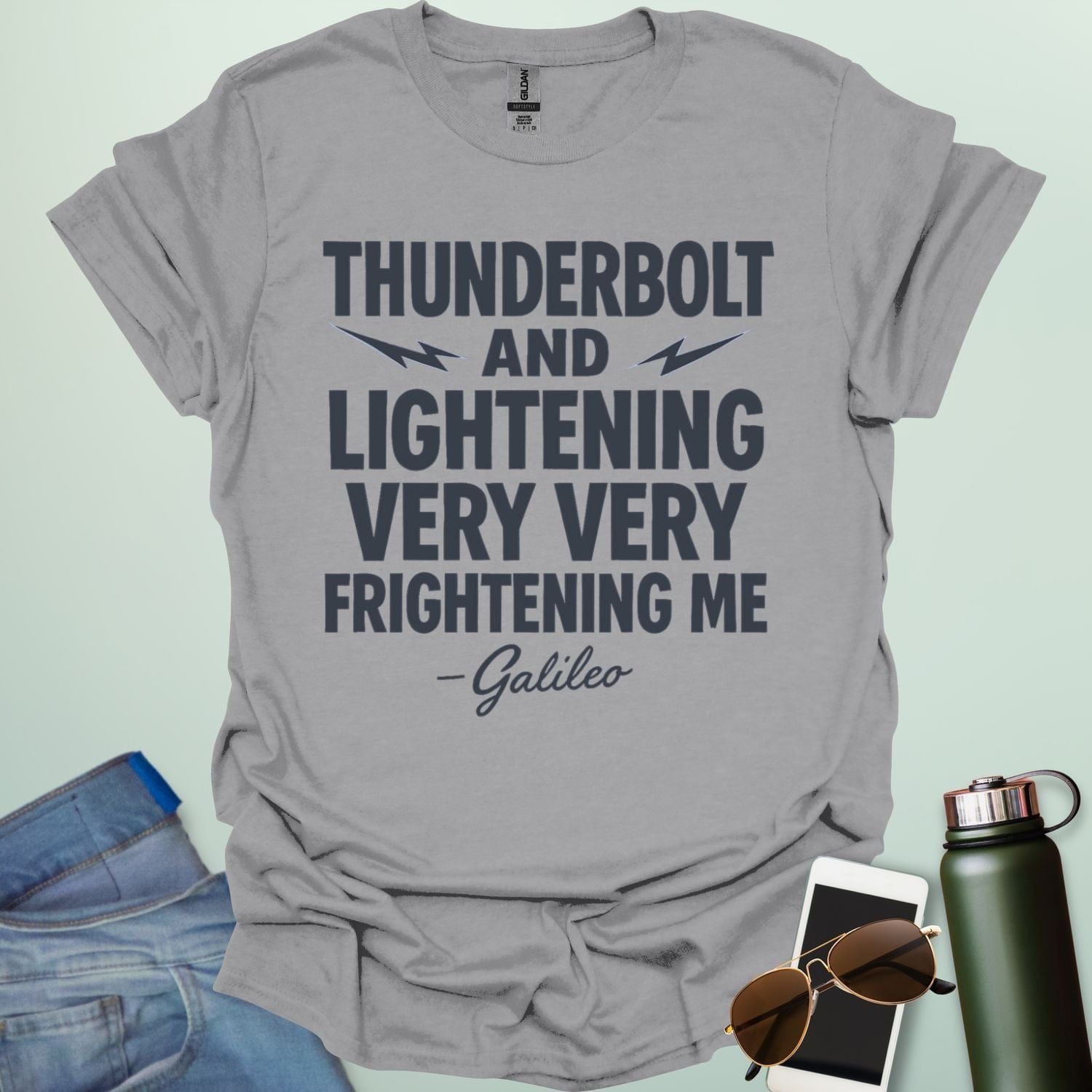 A sport grey t-shirt with the phrase 'THUNDERBOLT AND LIGHTENING VERY VERY FRIGHTENING ME' with lightning bolts, and '- Galileo' in script below.