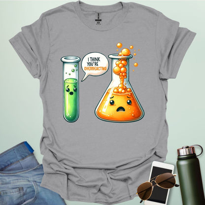 Sport Grey t-shirt with a graphic of two test tubes and a beaker on a light gray background. The test tube says, "I THINK YOU'RE OVERREACTING"