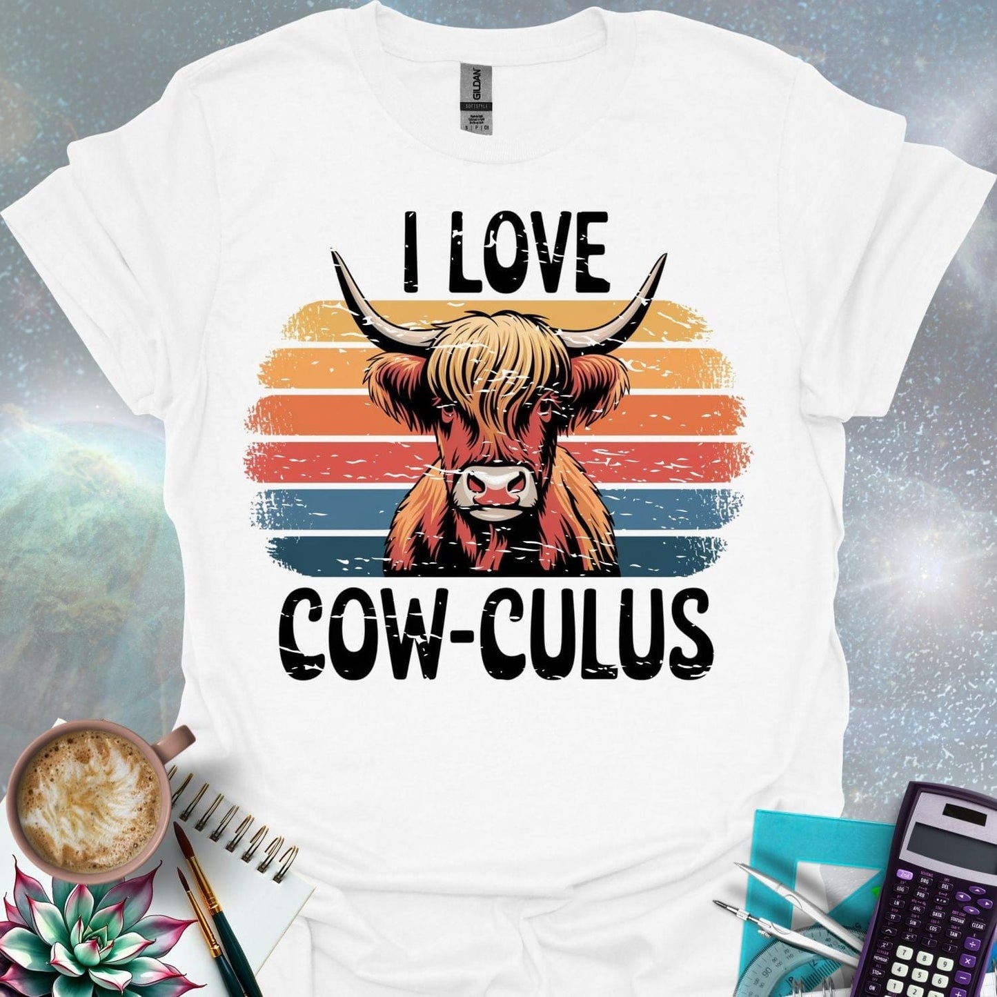 A Highland cow illustration with large horns and shaggy hair, overlaid on a distressed retro sunset graphic with horizontal stripes in shades of yellow, orange, red, and blue. The text 'I LOVE' is above the cow, and 'COW-CULUS' is below, both with a distressed appearance.