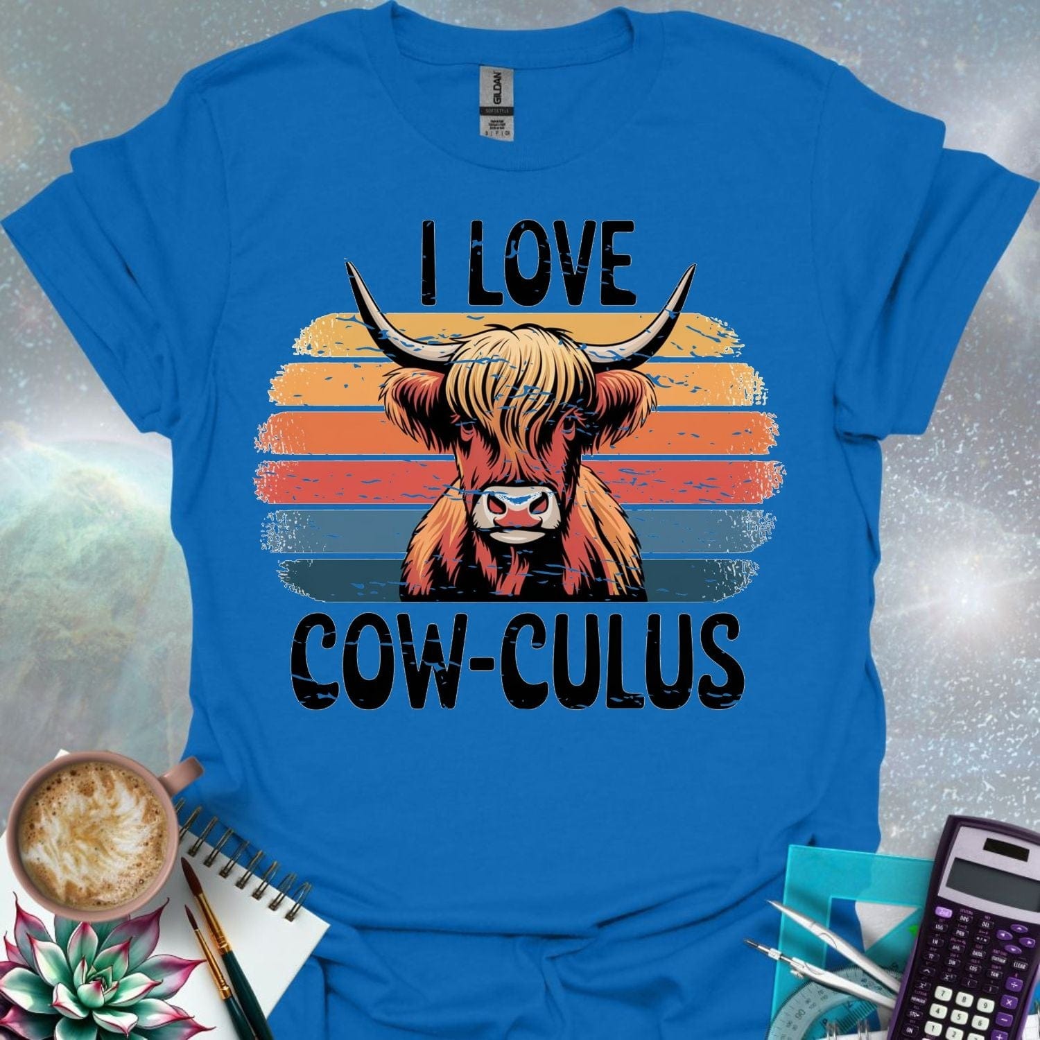 A Highland cow illustration with large horns and shaggy hair, overlaid on a distressed retro sunset graphic with horizontal stripes in shades of yellow, orange, red, and blue. The text 'I LOVE' is above the cow, and 'COW-CULUS' is below, both with a distressed appearance.