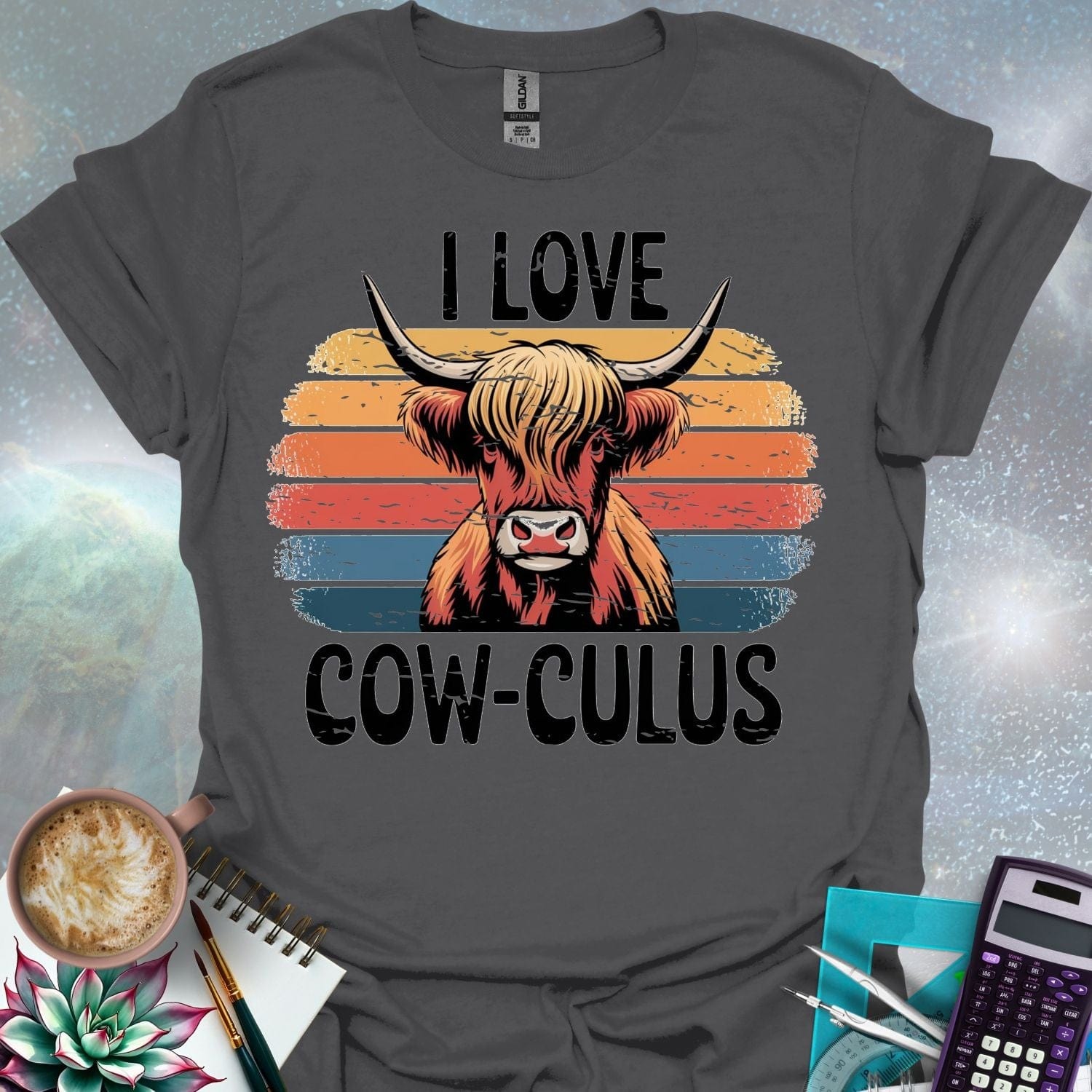 A Highland cow illustration with large horns and shaggy hair, overlaid on a distressed retro sunset graphic with horizontal stripes in shades of yellow, orange, red, and blue. The text 'I LOVE' is above the cow, and 'COW-CULUS' is below, both with a distressed appearance.