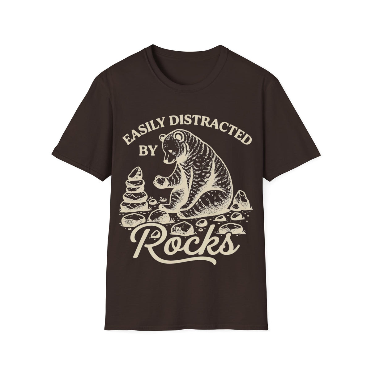 Linocut-style illustration of a bear sitting down examining a stone beside a cairn stack, framed by text reading 'EASILY DISTRACTED BY ROCKS'.