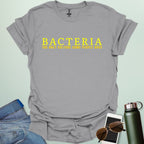 A sport grey t-shirt with the text 'BACTERIA THE ONLY CULTURE SOME PEOPLE HAVE' in yellow, bold font.