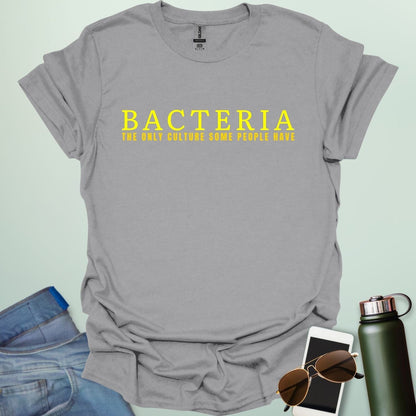 A sport grey t-shirt with the text 'BACTERIA THE ONLY CULTURE SOME PEOPLE HAVE' in yellow, bold font.