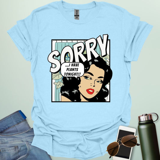 A light blue t-shirt with a retro comic-book style illustration of a woman and the text 'SORRY ...I HAVE PLANTS TONIGHT!!'