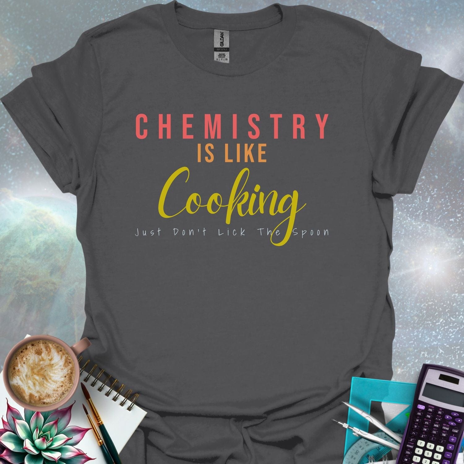 The text 'CHEMISTRY IS LIKE COOKING - JUST DON'T LICK THE SPOON' in a stylized font.