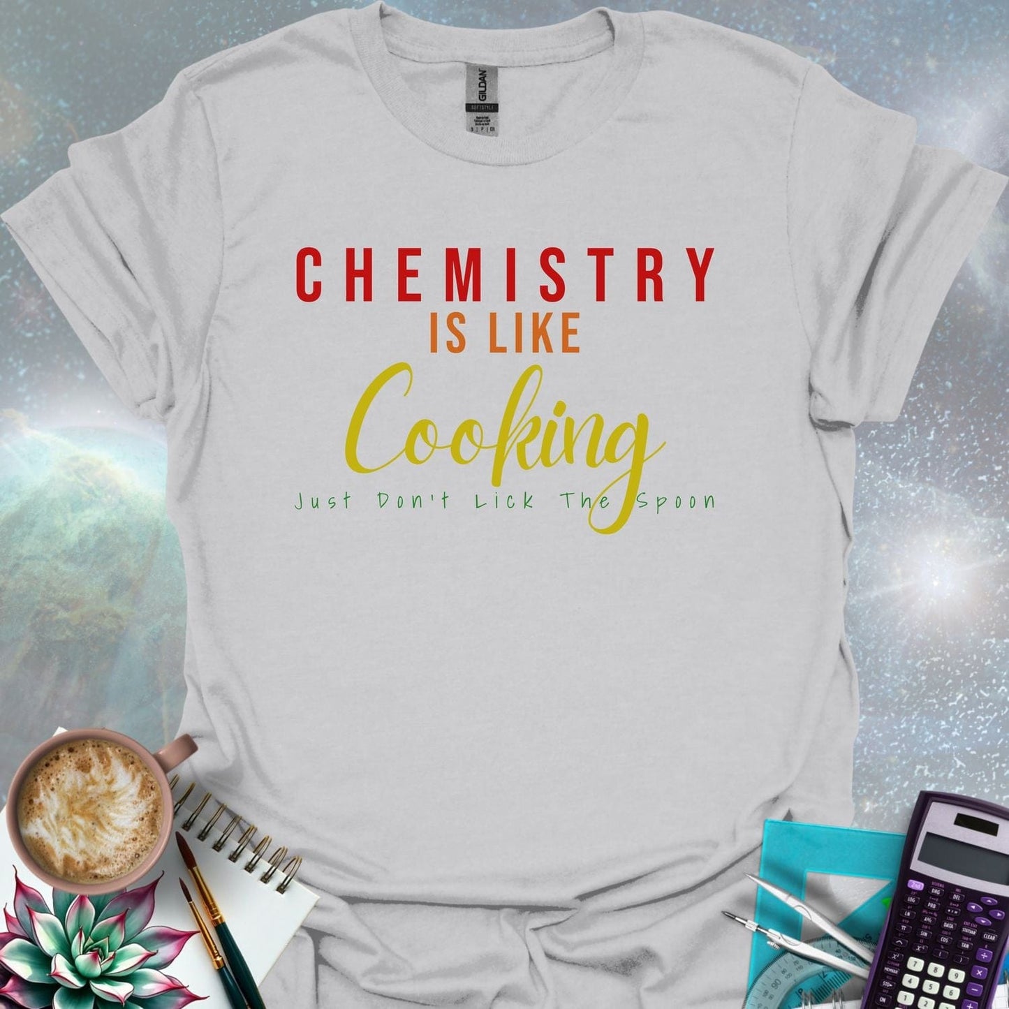 The text 'CHEMISTRY IS LIKE COOKING - JUST DON'T LICK THE SPOON' in a stylized font.