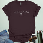 A dark chocolate t-shirt with the phrase 'women in technology' in an elegant cursive font, with a small bow underneath.