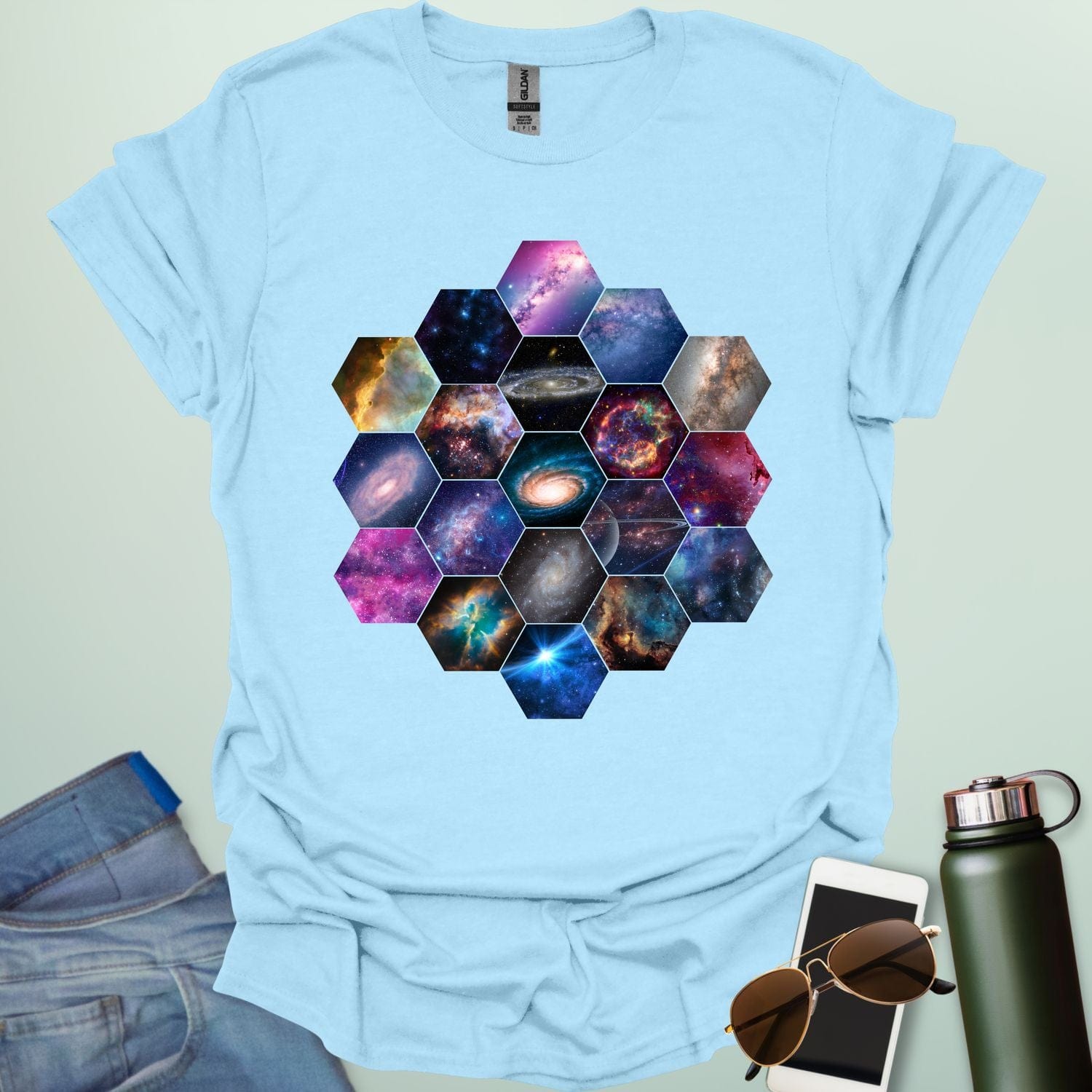 T-shirt design featuring a hexagonal pattern inspired by the James Webb Space Telescope's mirror, each hexagon filled with a different image of the cosmos.