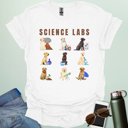 A white t-shirt with the text 'SCIENCE LABS' and a grid of nine illustrations of Labrador Retrievers in various science-themed scenarios.