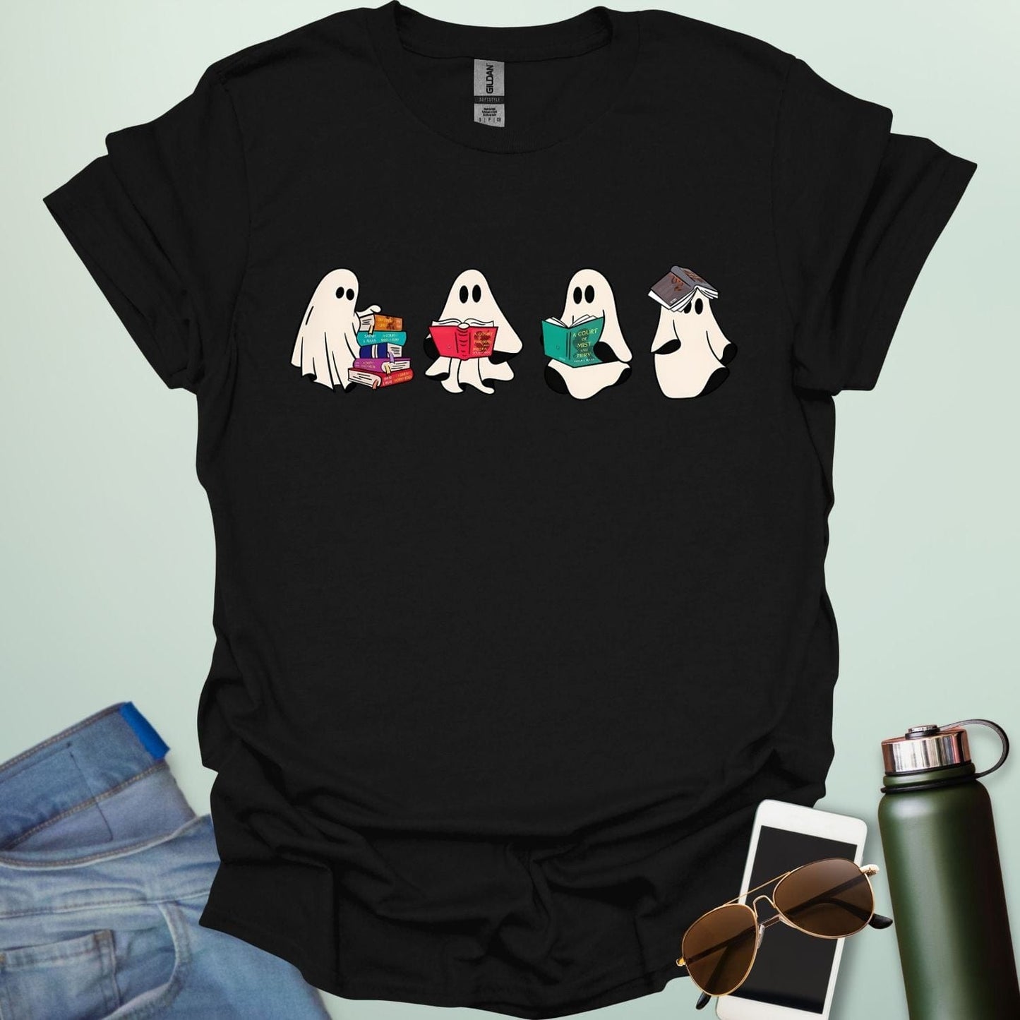 Ghost Readers t-shirt with ghost reading books graphic — spooky Halloween tee for book lovers, teachers, and readers who love a good ghost story.