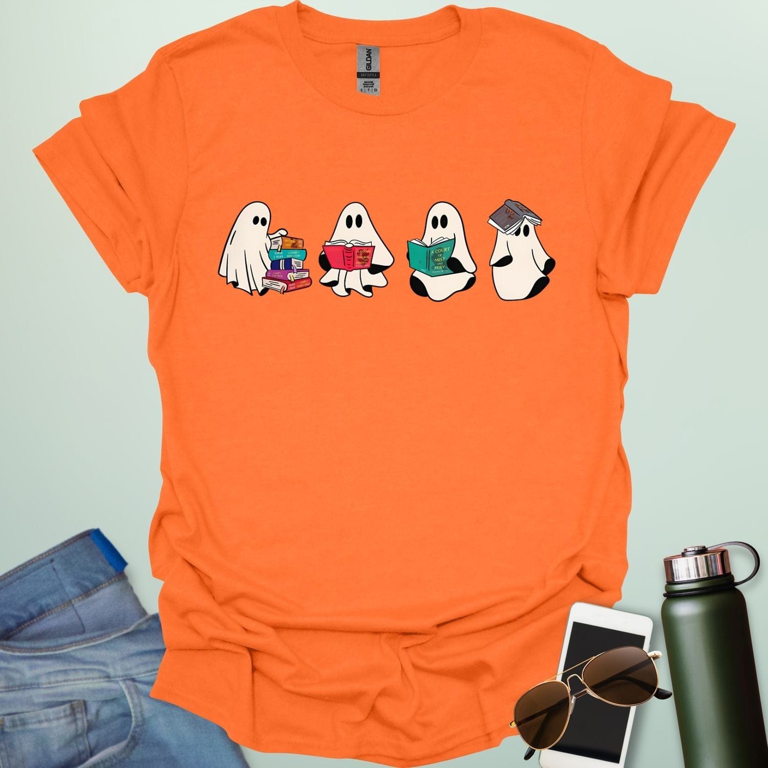 Ghost Readers t-shirt with ghost reading books graphic — spooky Halloween tee for book lovers, teachers, and readers who love a good ghost story.