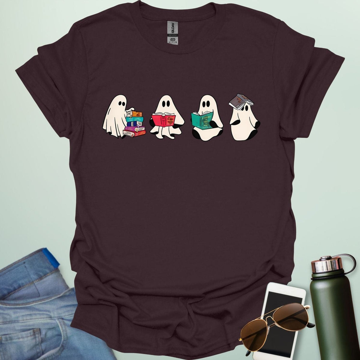 Ghost Readers t-shirt with ghost reading books graphic — spooky Halloween tee for book lovers, teachers, and readers who love a good ghost story.