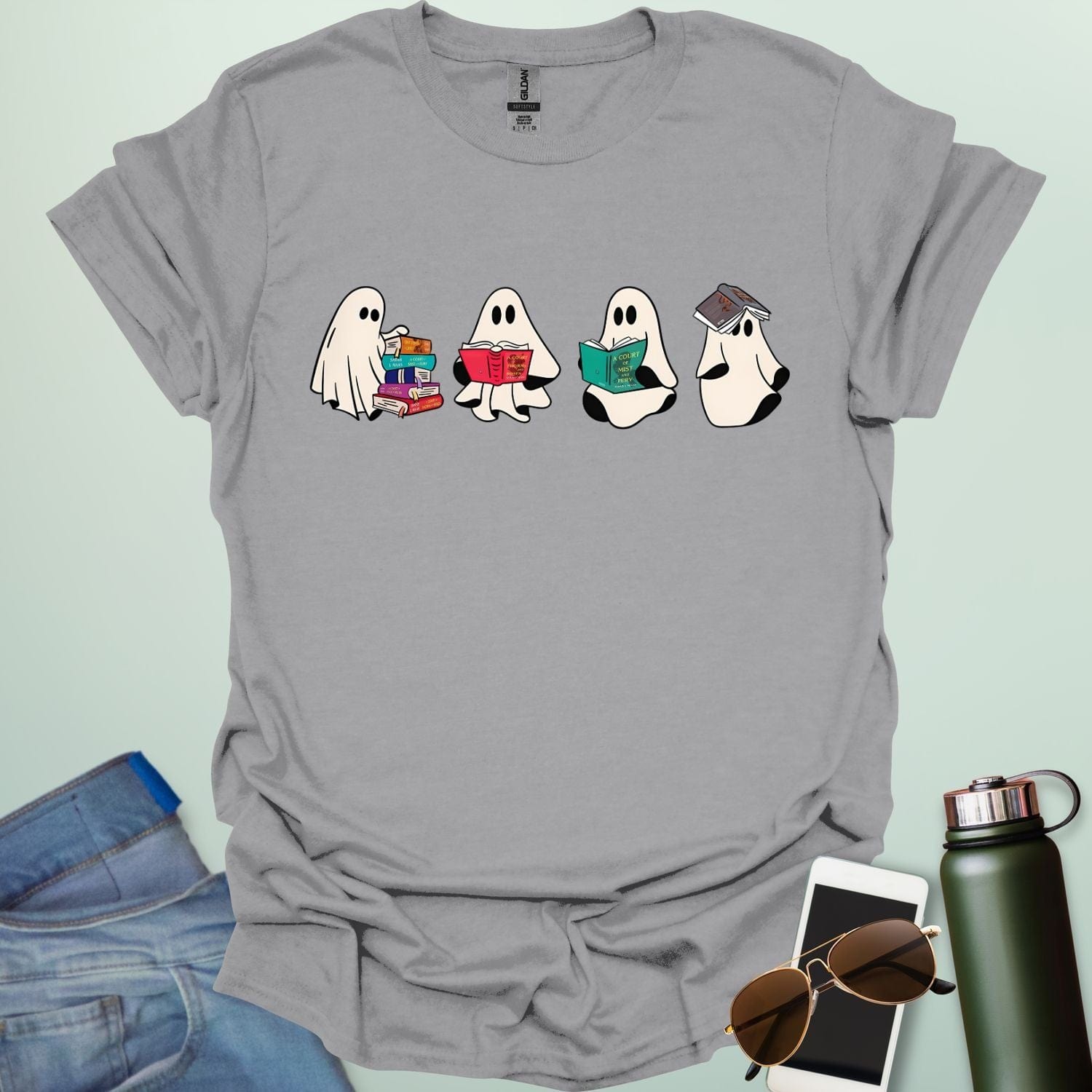 Ghost Readers t-shirt with ghost reading books graphic — spooky Halloween tee for book lovers, teachers, and readers who love a good ghost story.